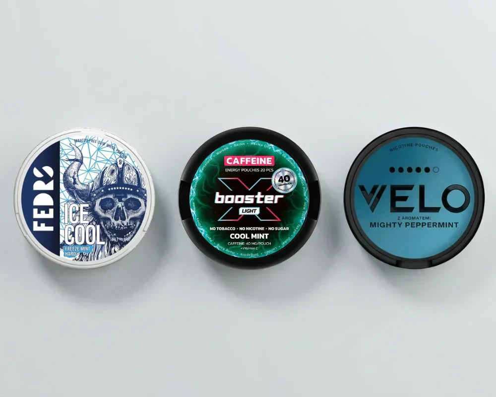 Trzy puszki obok siebie: FEDRS Ice Cool, napój energetyczny Cool Mint i VELO Mighty Peppermint
